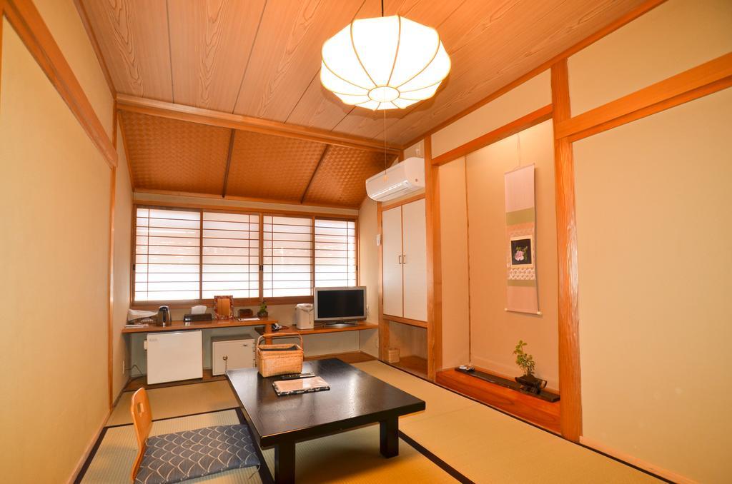 Kunisaki Hotel Unzen Quarto foto